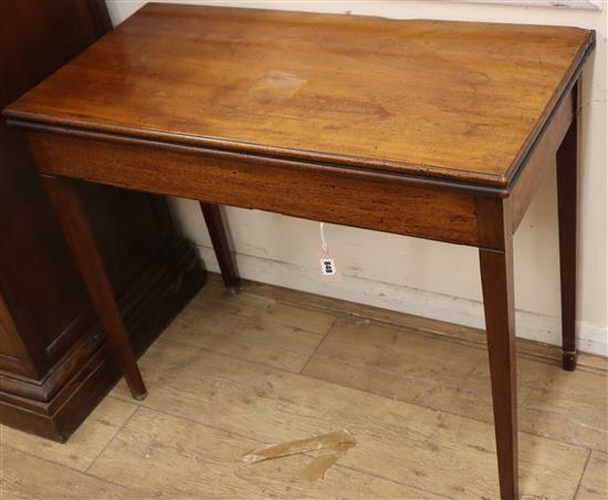 A George III rectangular mahogany folding tea table W.89cm